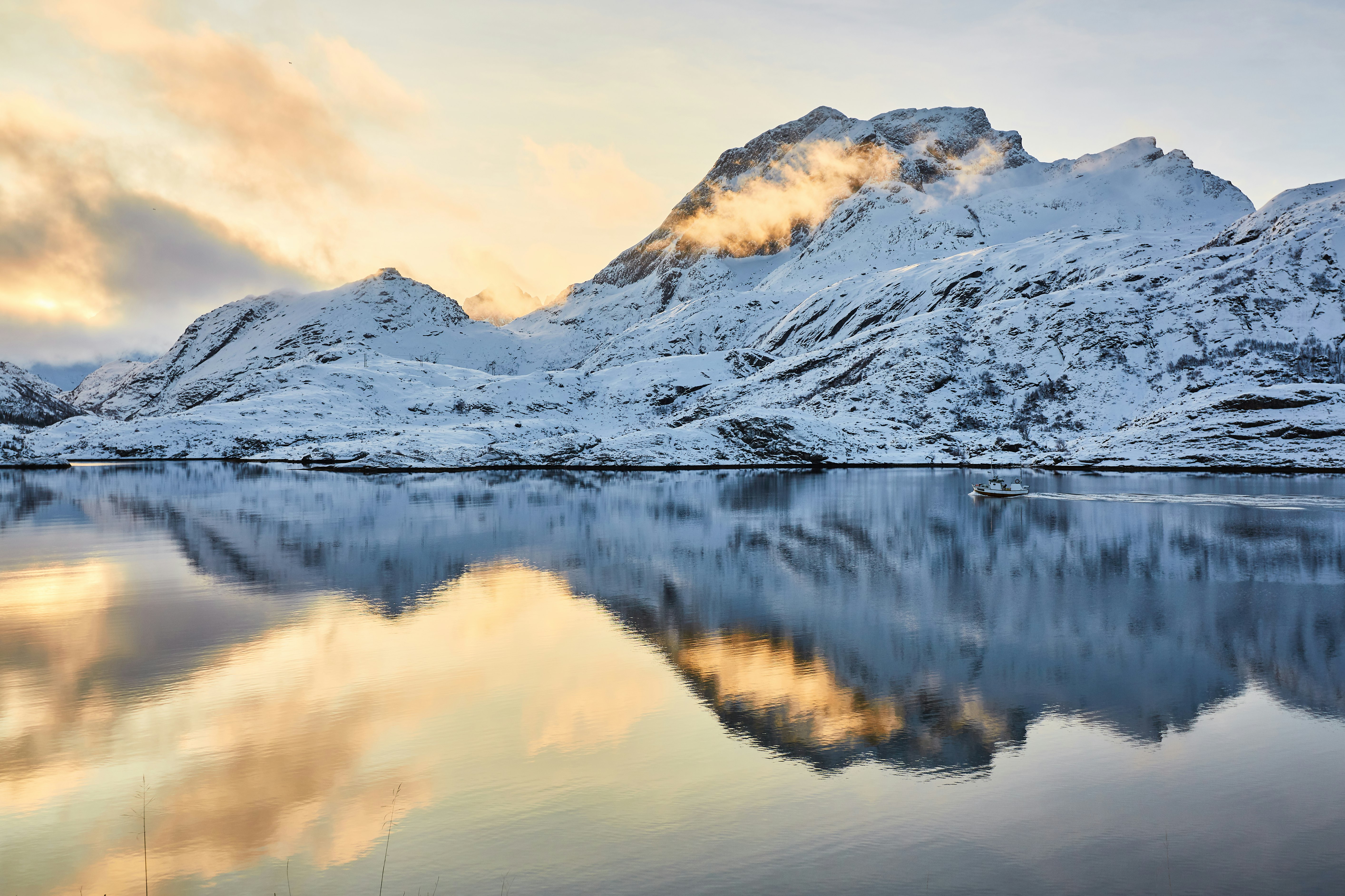 mountain with snow and reflection on water